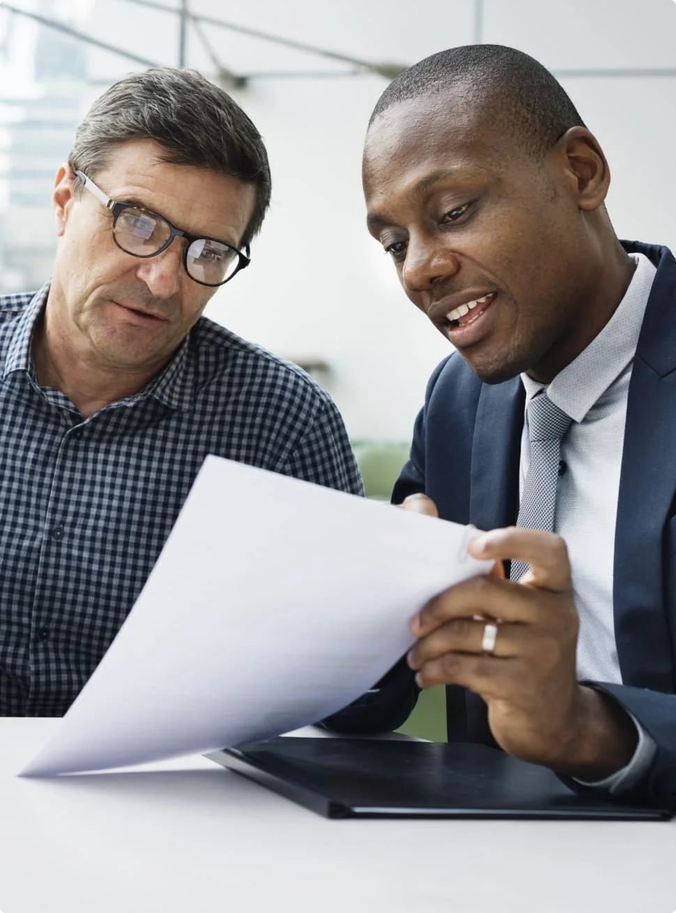 brokerage consultants reviewing paperwork